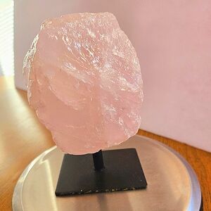 Rose quartz crystal on stand